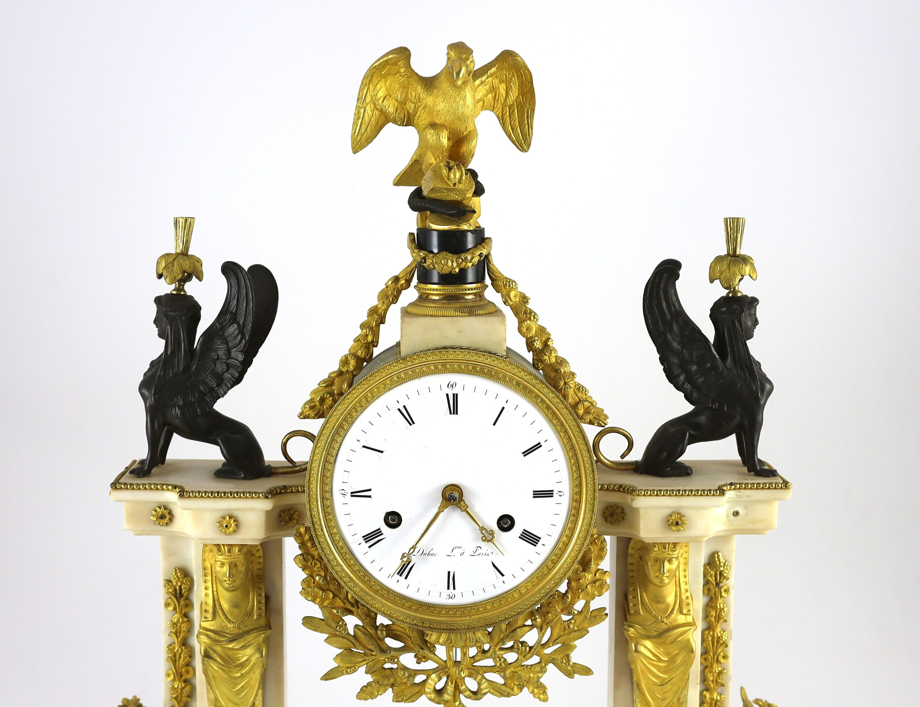 Jean Baptiste Dubuc L'ne à Paris. A Louis XVI bronze and ormolu mounted white marble mantel clock, width 43cm, depth 11cm, height 60cm